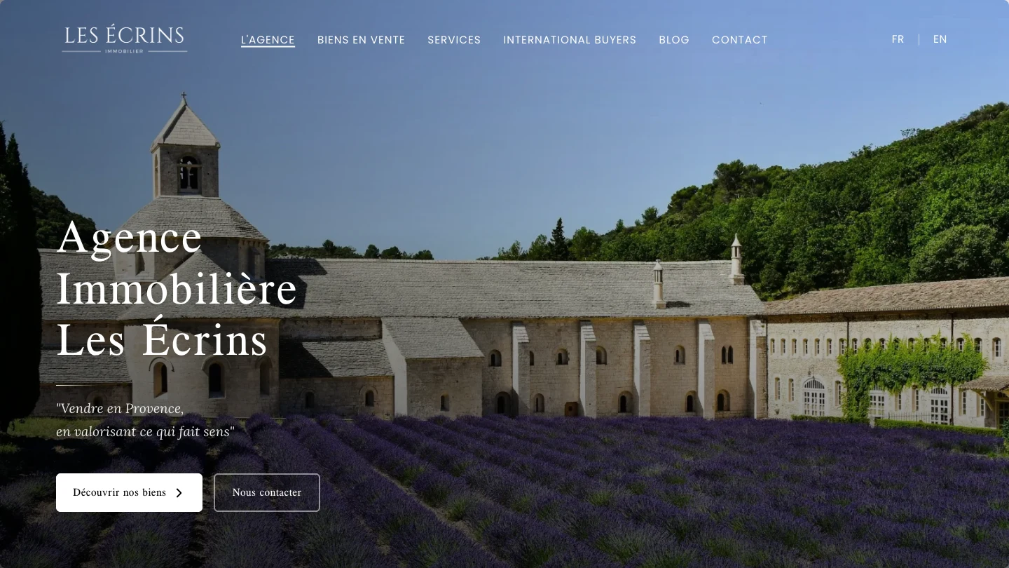 Page d’accueil de l’Agence Les Écrins sur ordinateur : photographie de Provence, présentation de l’agence et accès aux biens immobiliers.